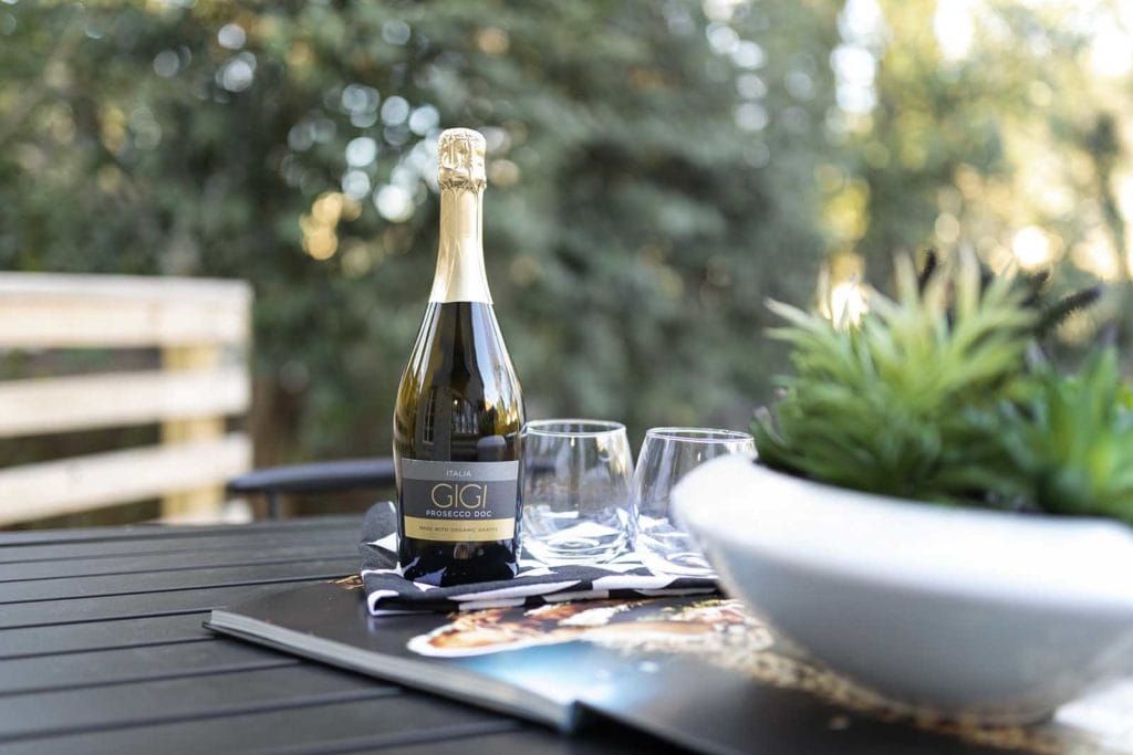 Wine Bottle on the Table in the Backyard